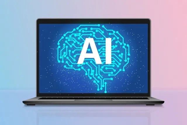 ノートパソコンの画面に人間の脳をイメージしたイラストとAIの文字が描かれている